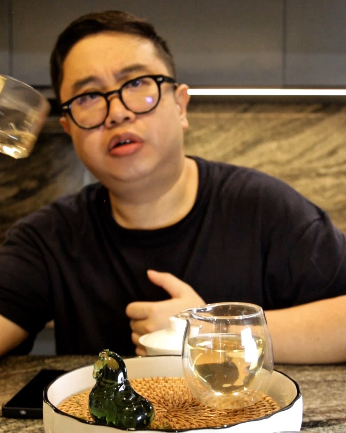 The writer looks up from a tasting cup while recognising an unexpected floral finish.